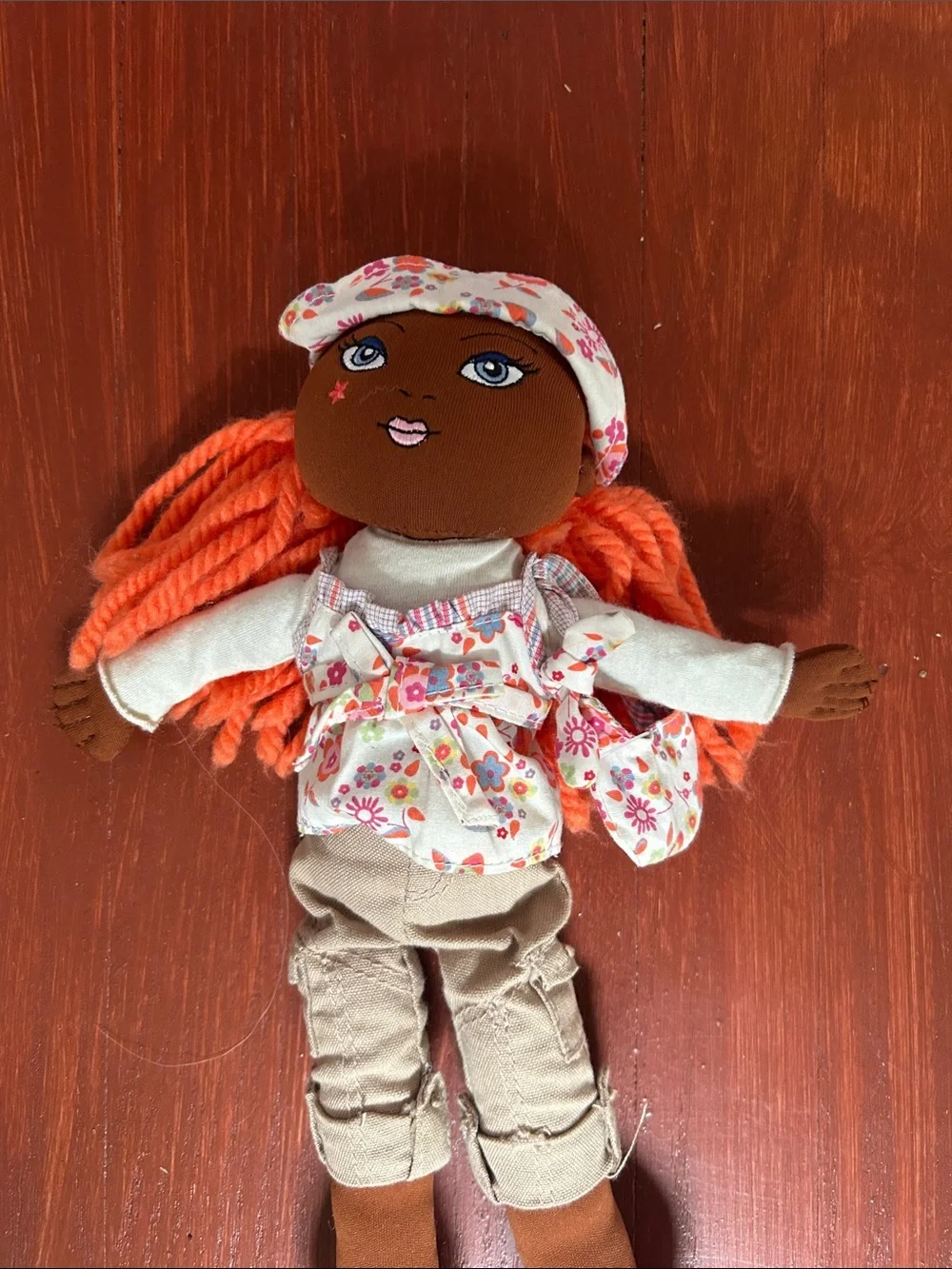 The Children's Place Brown Girl Rag Doll with Orange Yarn Hair and Floral Outfit